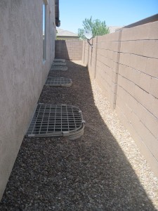 side of house.. those are the emergency exits to windows in basements